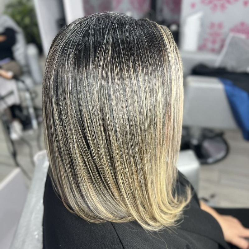Close-up of finished dimensional highlights on straightened hair